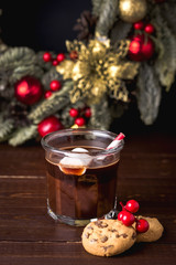 Close Up Homemade Tasty Hot Chocolate in Glass with Marshmallow Festive Christmas Background Candy Cane Vertical