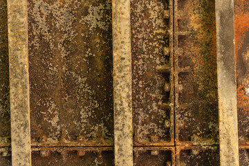 Textures of rusted iron with railways, screws and bolts