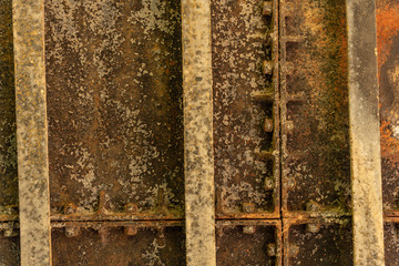 Textures of rusted iron with railways, screws and bolts