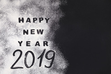 Happy New Year 2019 written on black background