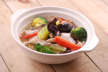 Fresh greens in clay pot