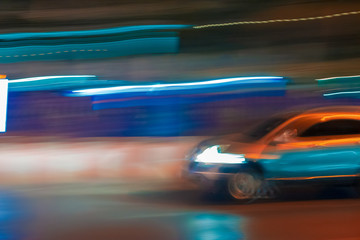 Fototapeta na wymiar Long exposure night time traffic trails with vibrant neon colors