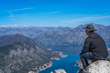 Tourist admiring landscape of Kotor Bay