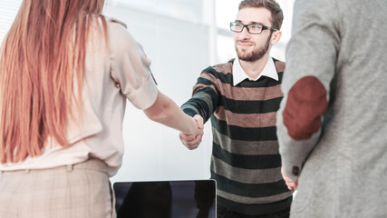 handshake between the client and the Manager of the company near the workplace