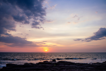 Naklejka na ściany i meble Sunset in Ashvem beach, Goa, India