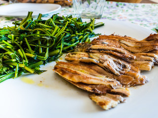dish of baked anchovies with chicory