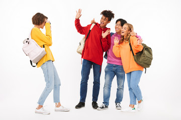 Fototapeta premium Group of cheerful teenagers isolated