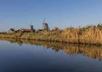Fototapeta premium Zaanse Schans, Netherlands - considered a real open air museum, Zaanse Schans presents a collection of well-preserved historic windmills and houses