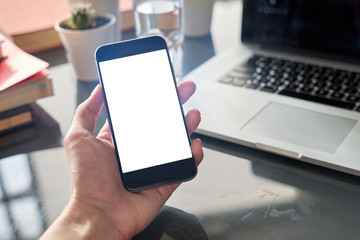 Closeup view woman hands using mobile smartphone. Space for design layout.