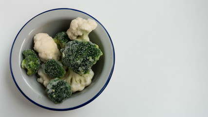 Frozen broccoli and cauliflower in plate