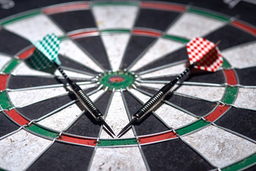 two darts on dartboard