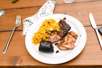 Paella dish with black pudding