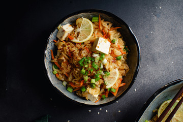 Vegetarian fried rice with tofu, peas and vegetables. Asian cuisine, healthy lunch