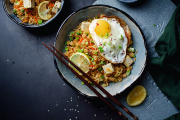 Vegetarian fried rice with tofu, peas and vegetables. Asian cuisine, healthy lunch