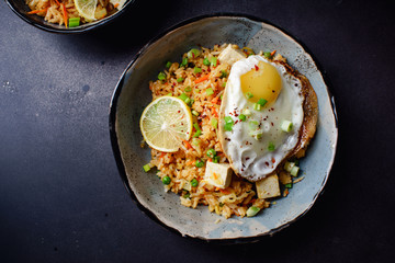 Vegetarian fried rice with tofu, peas and vegetables. Asian cuisine, healthy lunch, copy space
