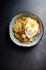 Vegetarian fried rice with tofu, peas and vegetables. Asian cuisine, healthy lunch