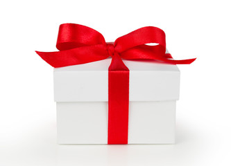 White One gift box with red ribbon bow, isolated on white background