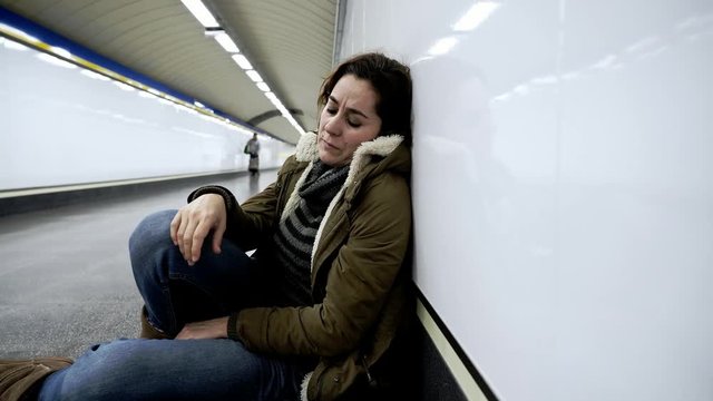 Hopeless and exhausted woman suffering depression and anxiety in subway tunnel in Work-life balance issues Negative body image Financial troubles and Stressful life events Mental health and loos of lo