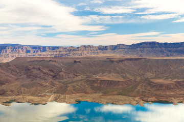 Fototapeta na wymiar landscape and nature concept - aerial view of grand canyon and lake mead from helicopter