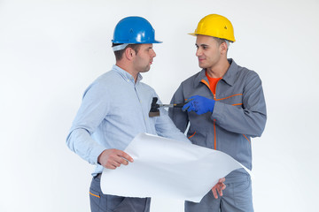 Two friendly male engineers discussing their project on white backgrond