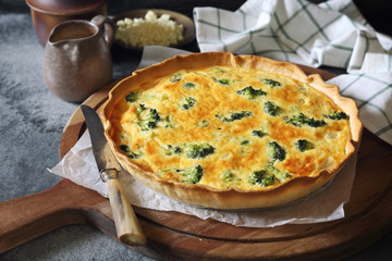 French cuisine. Quiche with broccoli  and grated cheese