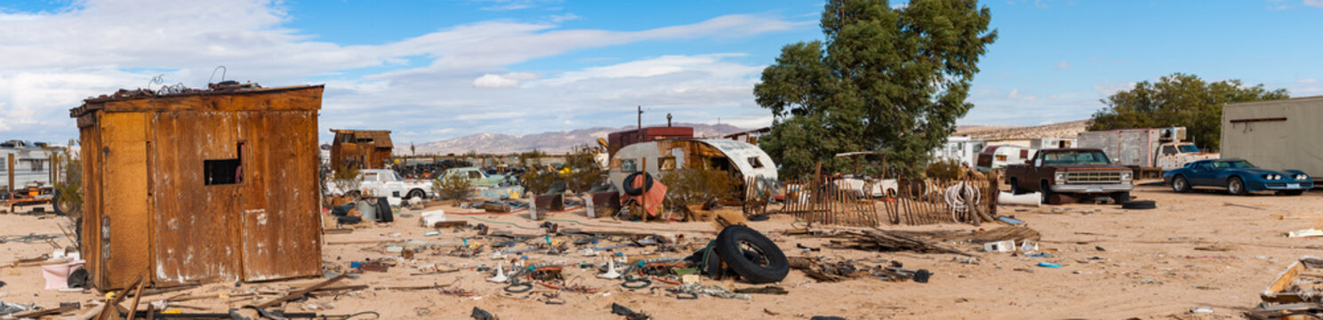 desert junkyard panorama in California