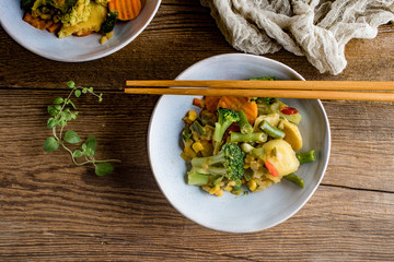 Stewed vegetables in ceramic bowls.