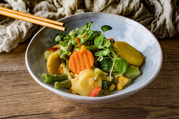 Stewed vegetables in ceramic bowls.