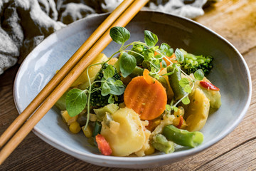 Stewed vegetables in ceramic bowls.