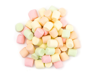 Pile of Colorful Fruit Flavored Marshmallows on a White Background