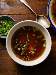 Japanese miso soup with tofu, wakame seaweed, spring onions and pepper flakes
