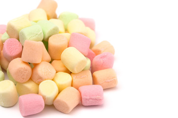 Pile of Colorful Fruit Flavored Marshmallows on a White Background