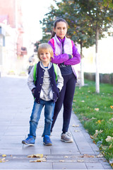 Students walk in the park after school.