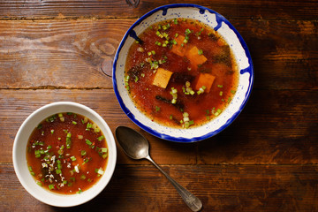 Japanese miso soup with tofu, wakame seaweed, spring onions and pepper flakes