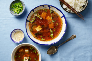Japanese miso soup with tofu, wakame seaweed, spring onions and pepper flakes