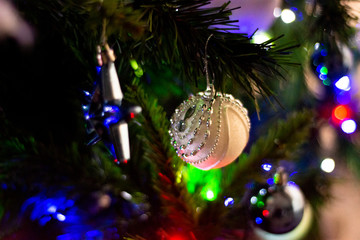 Christmas Tree with white, silver and blue details and xmas symbols like balls