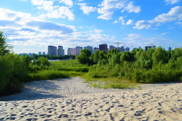 View through the desert to the city in the distance in nature. Summer landscape.