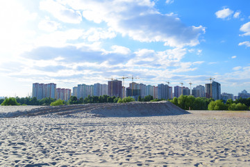 Obraz premium View through the desert to the city in the distance in nature. Summer landscape.