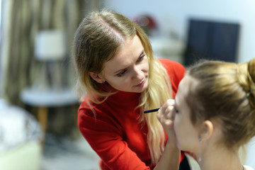 The concept of the work of the master makeup artist beautician.