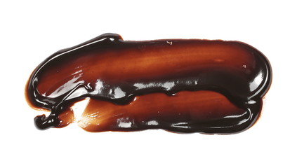 Melted chocolate for topping isolated on white background, top view