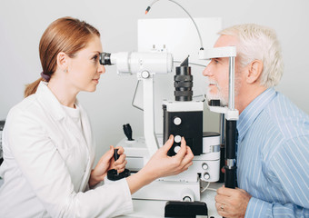 Fototapeta na wymiar Senior patient checking vision with special eye equipment
