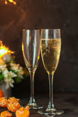 Champagne glasses, sparklers and a bunch of bubbles (holiday), top view. copy space