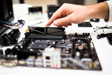Hand assembling a desktop computer