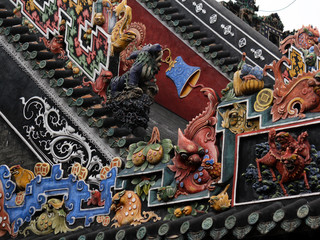 Colorful and painted stone relief in Ancestral Hall