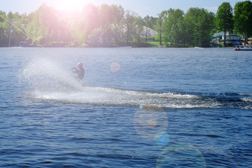 Athlete wakeboarder performs a jump with a somersault in the air