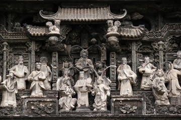 Stone relief showing a historic chinese traditional lifestyle scene at Chen Clan Ancestral Hall in Guangzhou, China, Asia