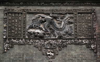 Stone relief showing traditonal chinese symbolic animals and flowers in Chen Clan Ancestral Hall in Guangzhou, China, Asia