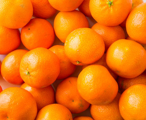Top view. Fresh tangerines. Ripe and tasty mandarins. Clementines. Background tangerines.