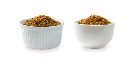 Fenugreek seeds in a wooden bowl isolated on white. Fenugreek seeds isolated on white background. Fenugreek with copy space for text.