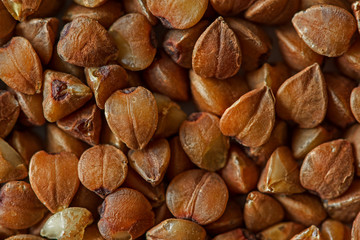 buckwheat or white background, macro. Buckwheat on a white background, macro. Buckwheat grain extreme closeup. Isolated on. 